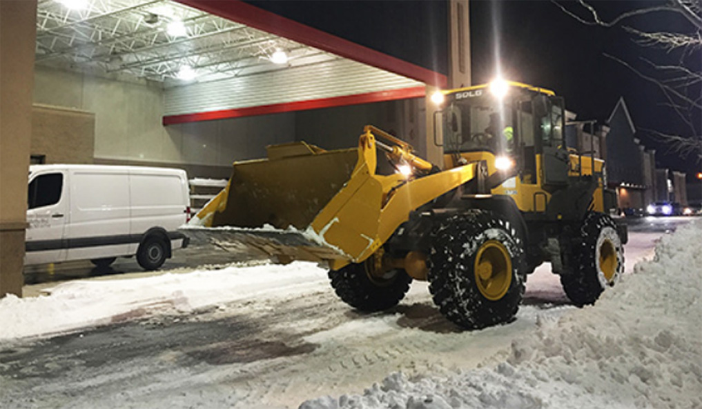 Stasi Brothers uses SDLG front loader for snow removal